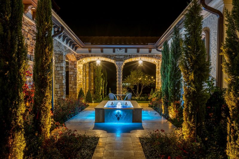 A gorgeously lit loggia area by Outdoor Lighting Perspectives