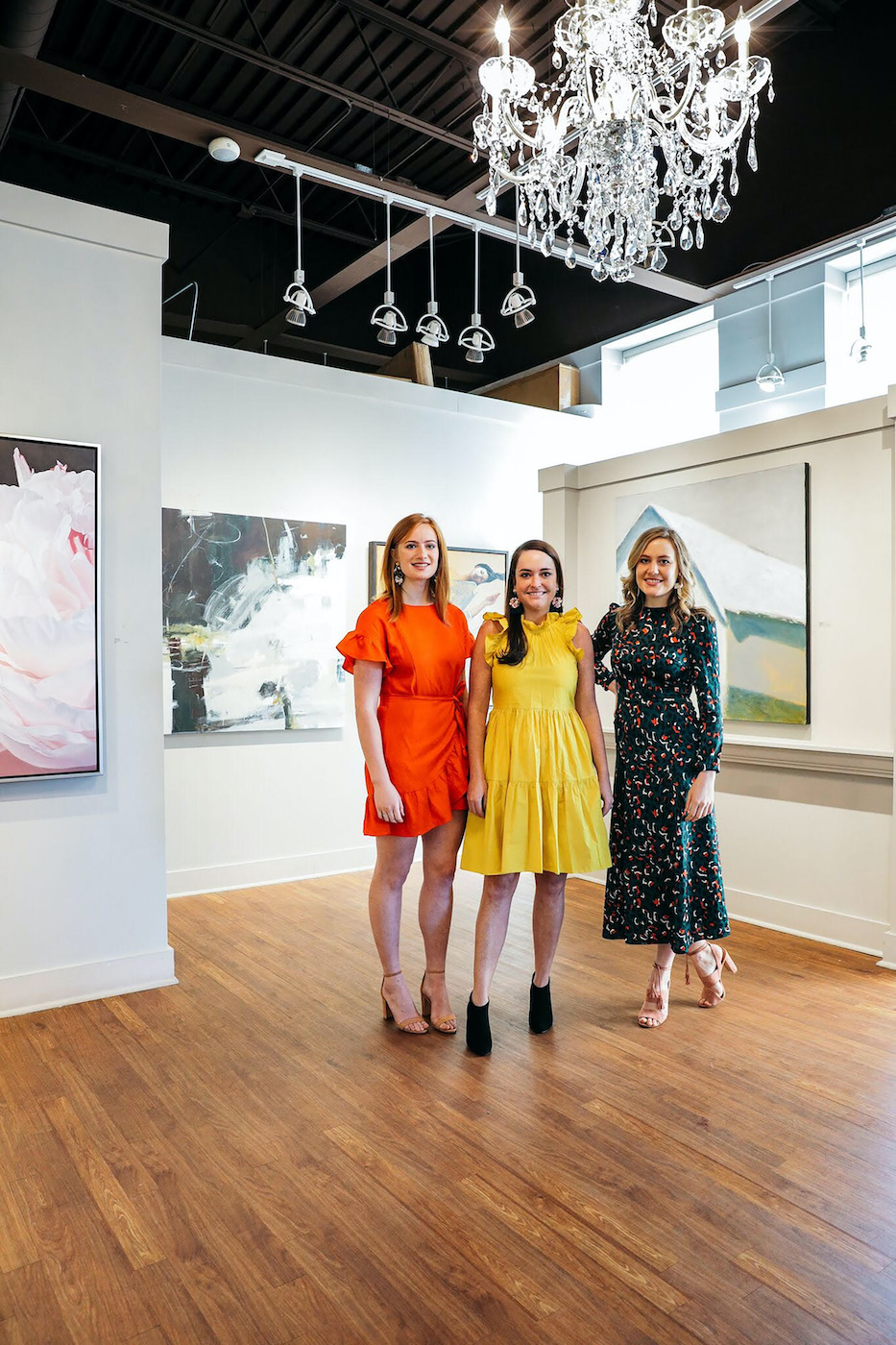 three women standing in shain gallery