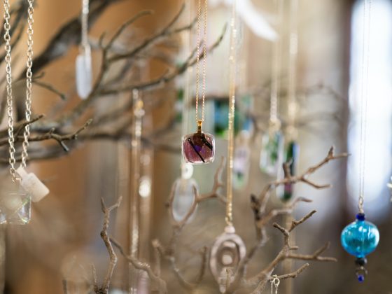 glass art dangling from tree hanger