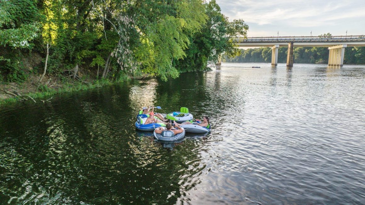 four people tubing on the catawba river