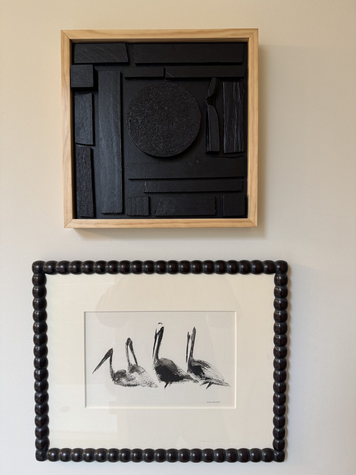 sketch of birds hanging beneath textural black art