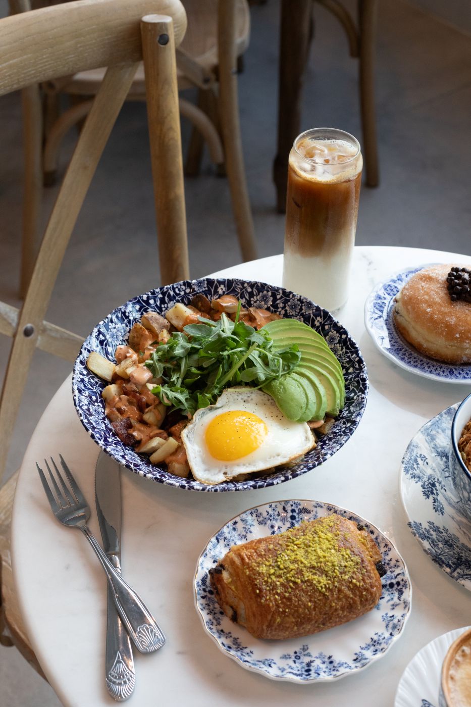 papas breakfast bowl, pastry, and espresso drink at maman charlotte